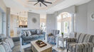 Wide Beautiful Living Room With Grey and Stripe Couch Set