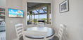 White and Brown Kitchen Table With Beautiful Paintings