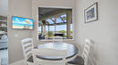 White and Brown Kitchen Table With Beautiful Paintings