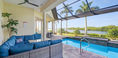 Blue Covered Lounge Couch Near Pool Area