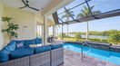 Blue Covered Lounge Couch Near Pool Area