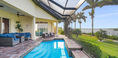 Swimming Pool View With Two Outdoor Chairs and Blue Covered Couch Set