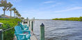 Green Wooden Chairs in Waterfront Side