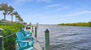 Green Wooden Chairs in Waterfront Side