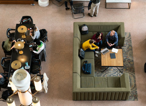 Aerial view of agents going through data and analytics insights to improve customer experience