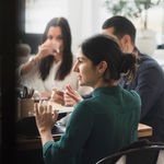 A female manager having a meeting with his team discussing how 8x8’s partner program can help them grow their business.