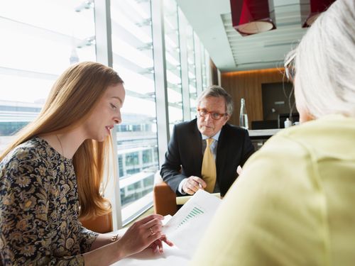 Insurance agent offering financial services and advice to clients