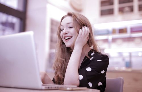 young-lady-in-office-using-microsoft-teams-voice.jpg