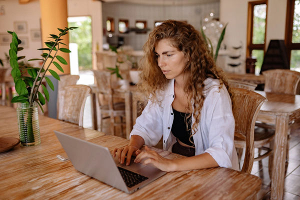 A girl using customer relationship management software on laptop