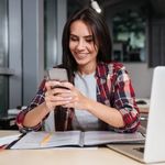 Employee using VoIP on her smartphone