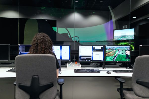 Woman sitting and using cloud computing software