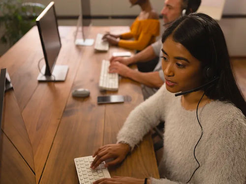 A group of telemarketing agents working in a call center