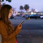 Woman using her mobile phone on the streets