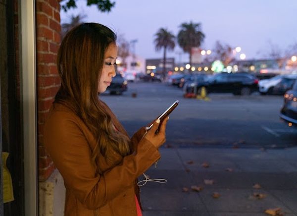 Woman using her mobile phone on the streets