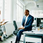 Team lead talking to her employee about 8x8's unified communications platform