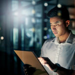 A man working on a tablet using OTP