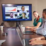 Employees using 8x8 HD video conferencing for real-time collaboration