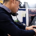 Office worker using a VoIP phone