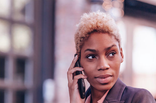 woman-using-non-fixed-voip-number-with-smartphone.png