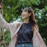 A girl taking a selfie outdoors