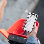 Businessman using the 8x8 app to connect with his team while away from the office