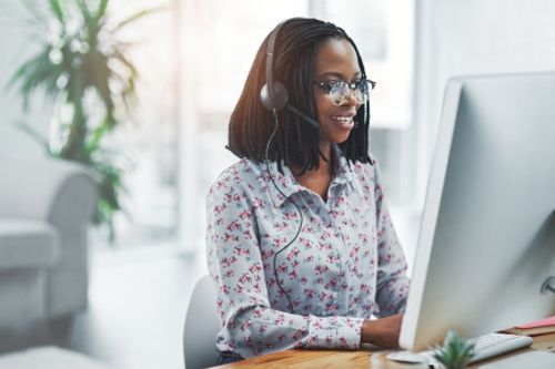 a call center agent helping a customer in need during their shift