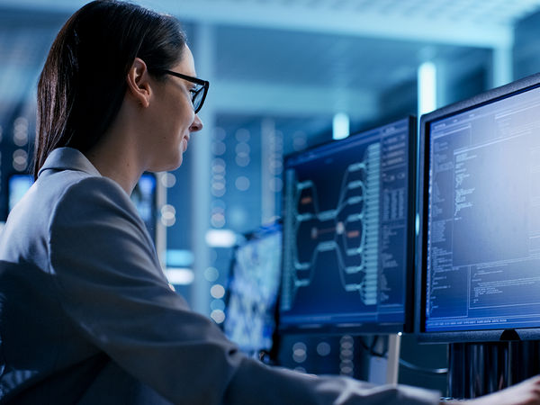 Woman in a logistics company monitoring dispatch statuses