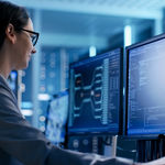 Woman in a logistics company monitoring dispatch statuses