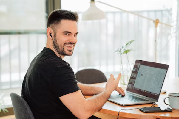 A man on a call with a customer with the help of call center technology