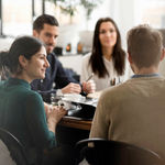 A group of 4 in a meeting