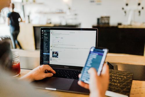 A mobile in front of a computer