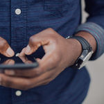 A man sending Viber messages with a mobile phone