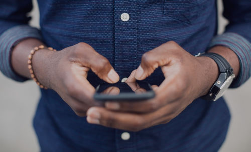 A man sending Viber messages with a mobile phone