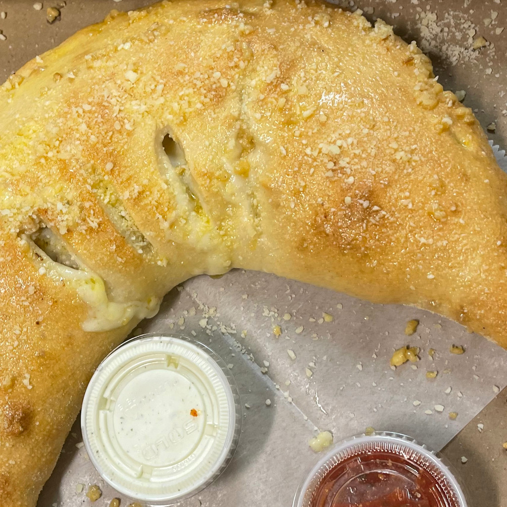 Image-Any Two Toppings Calzone or Strombolis with Drink