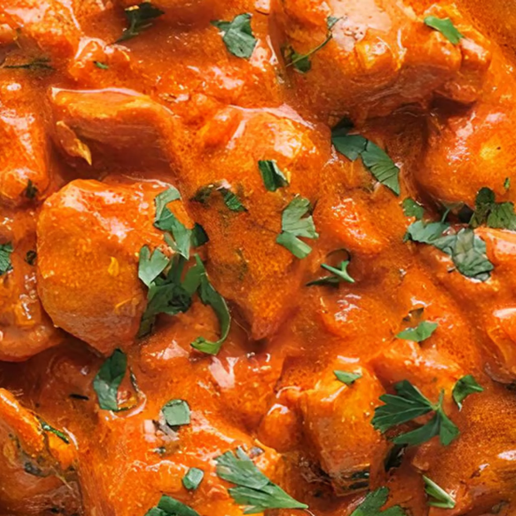 Image-Butter Chicken Curry (of cashew nut sauce) with Rice.