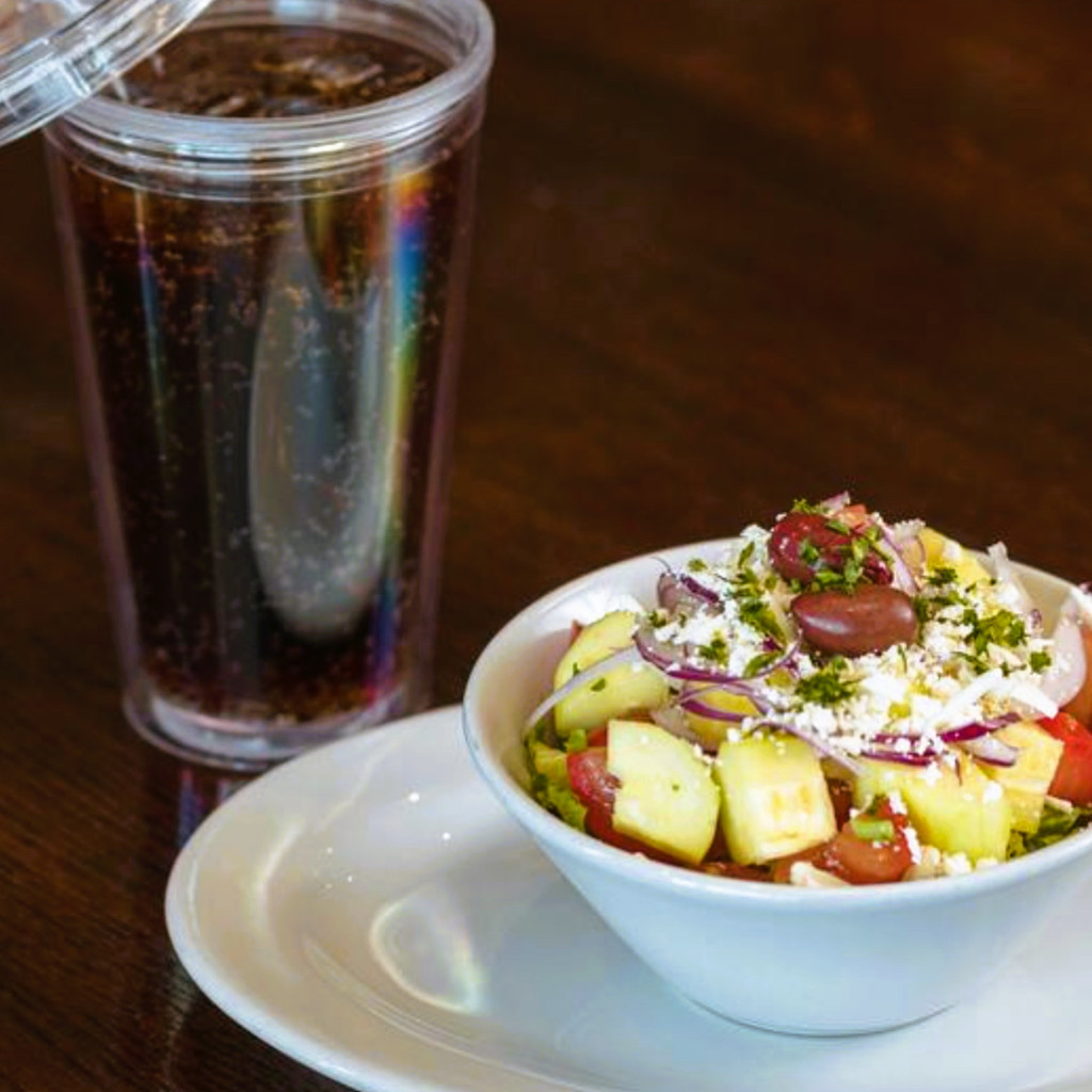 Image-Side house salad & medium soda.