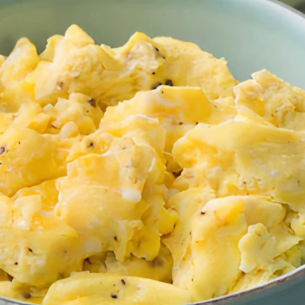 Image-Side of Scrambled eggs with cheese