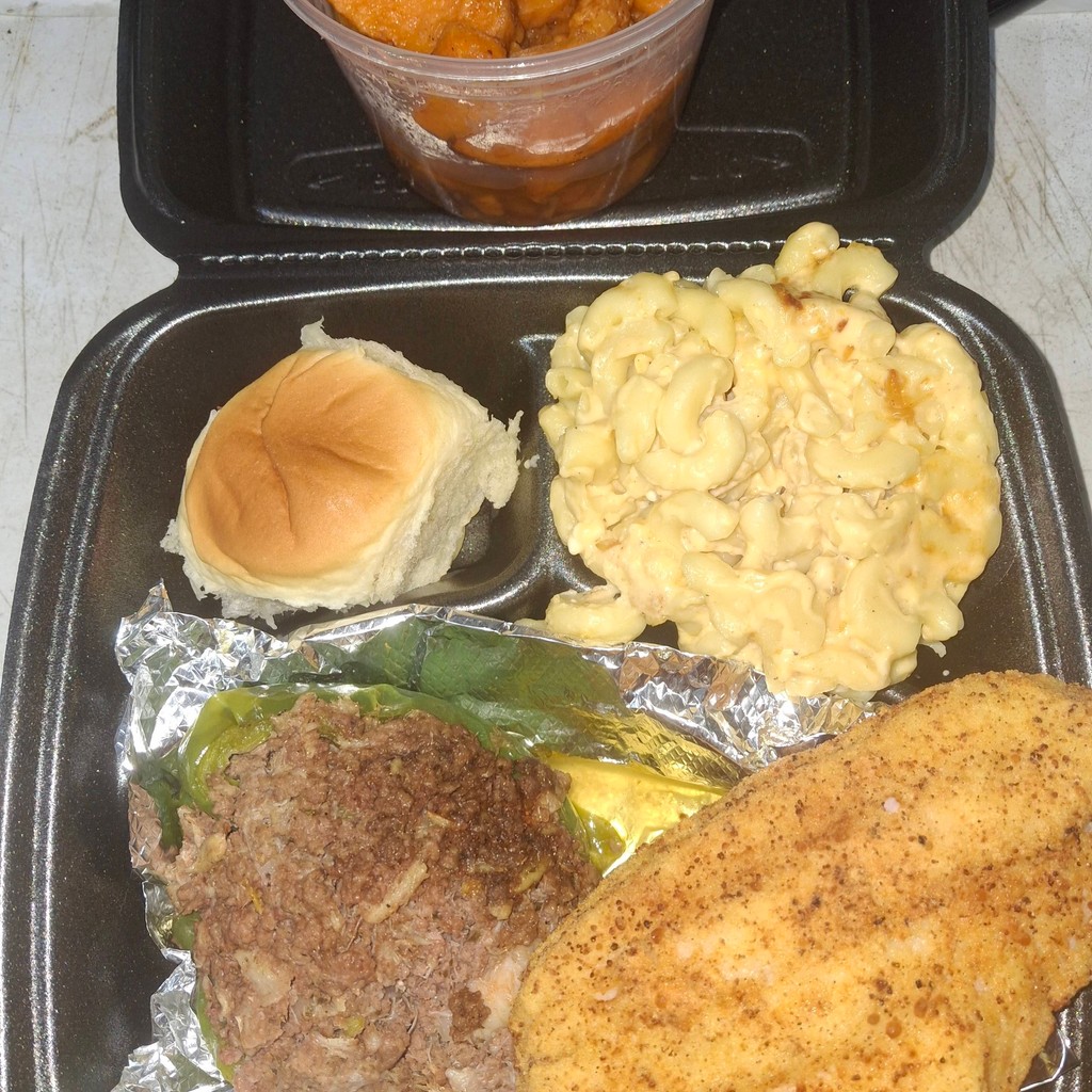 Image-Stuffed Bell peppers w Catfish served mac & candid yams