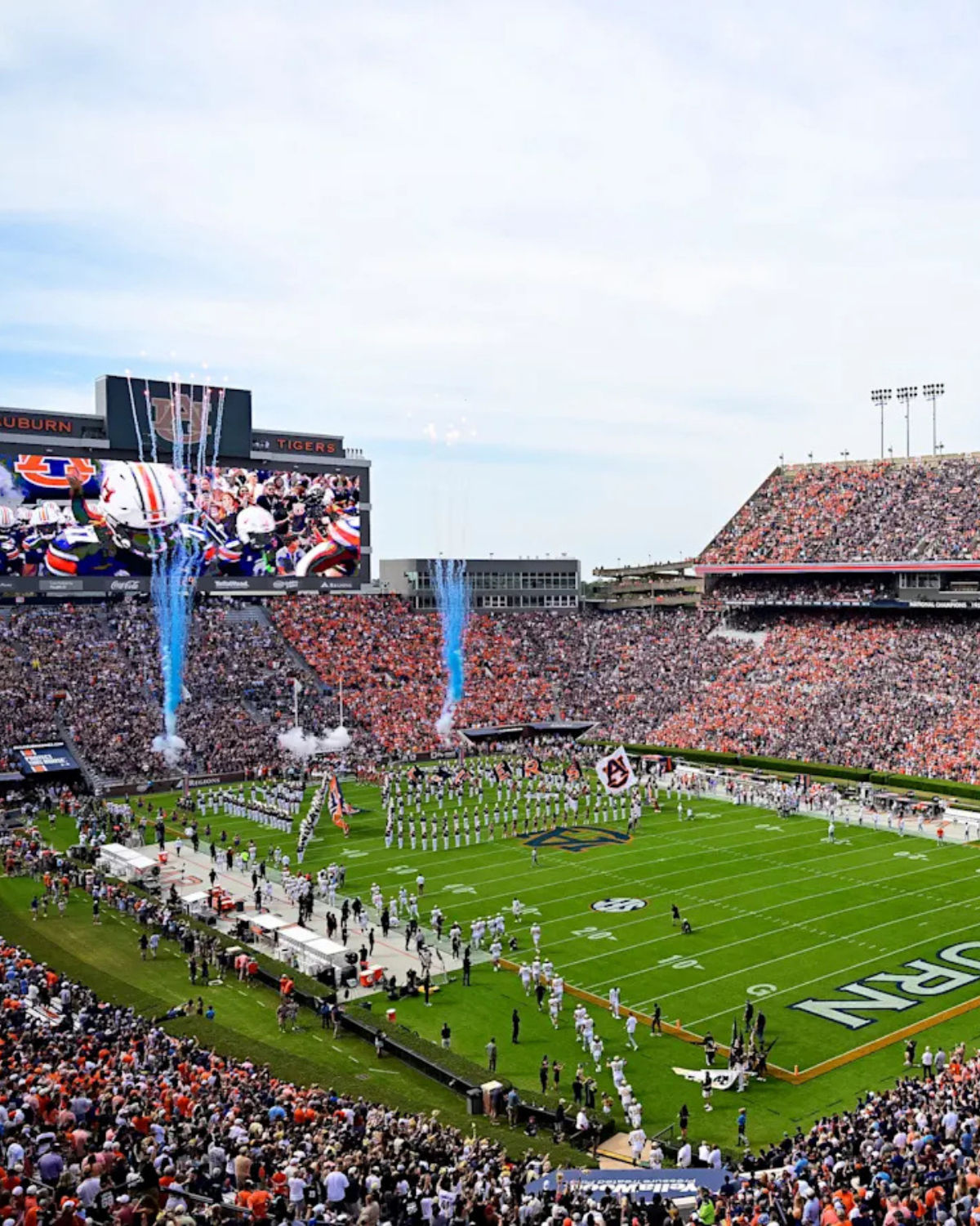 Packed Auburn University football stadium filled with fans on game day, just minutes from Opelika, AL