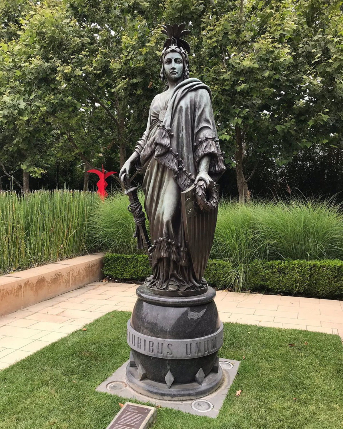 The Cerritos Sculpture Garden with tall white stone sculptures set in a landscaped public art space.