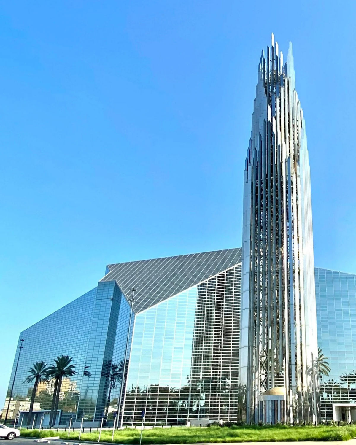 Christ Cathedral in Garden Grove with its reflective glass exterior and surrounding landscaping.
