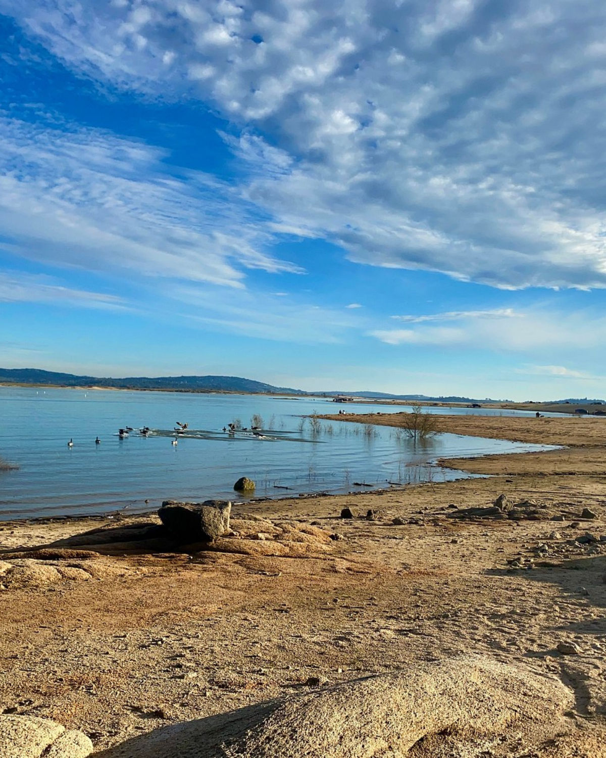 Granite Bay Beach at Folsom Lake with sandy shoreline, picnic areas, and calm water views.
