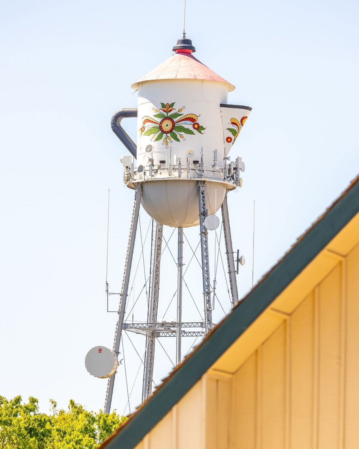 The Swedish Coffee Pot Water Tower in Kingsburg, a tall white landmark shaped like a giant coffee pot against the sky.