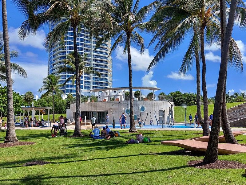 Tropical palm trees and fountain in South Pointe Park, Miami Beach, Florida