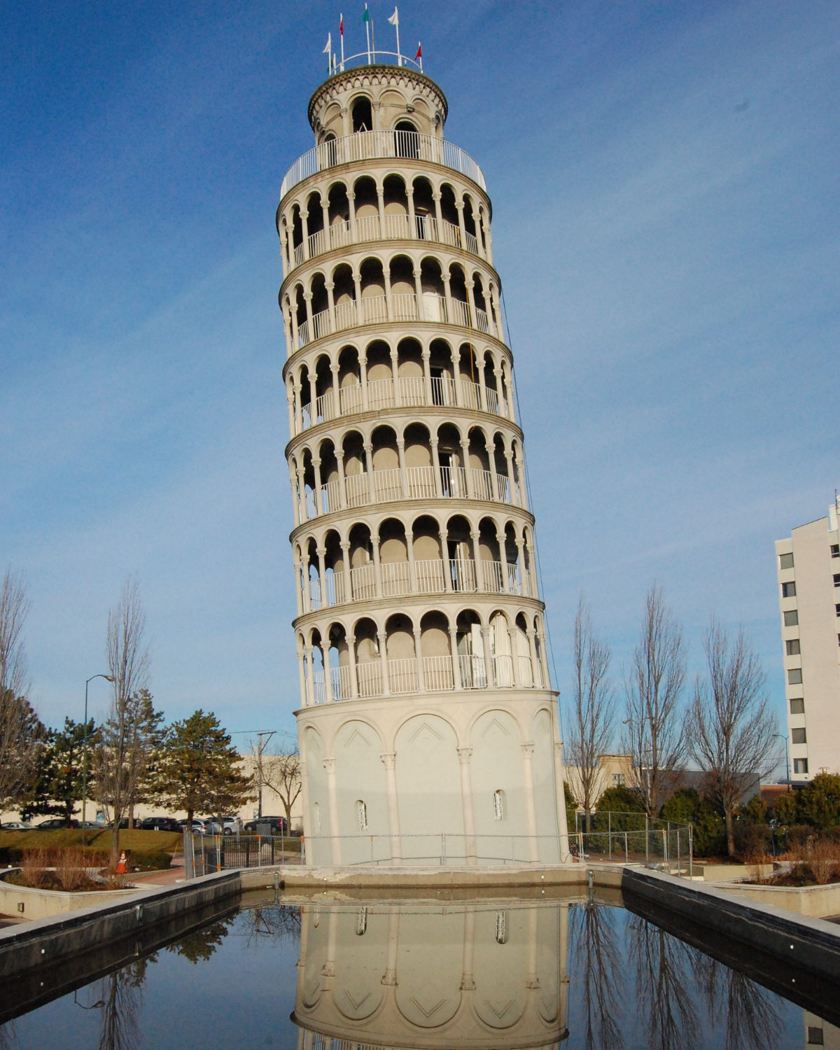 The iconic half-scale replica of the Leaning Tower of Pisa rising against a clear winter sky in Niles, Illinois near Morton Grove