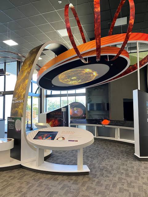 Interactive space science exhibit at NASA's Goddard Visitor Center in Greenbelt, Maryland, featuring educational displays, solar-themed installations, and hands-on exhibits about the Sun and space exploration.