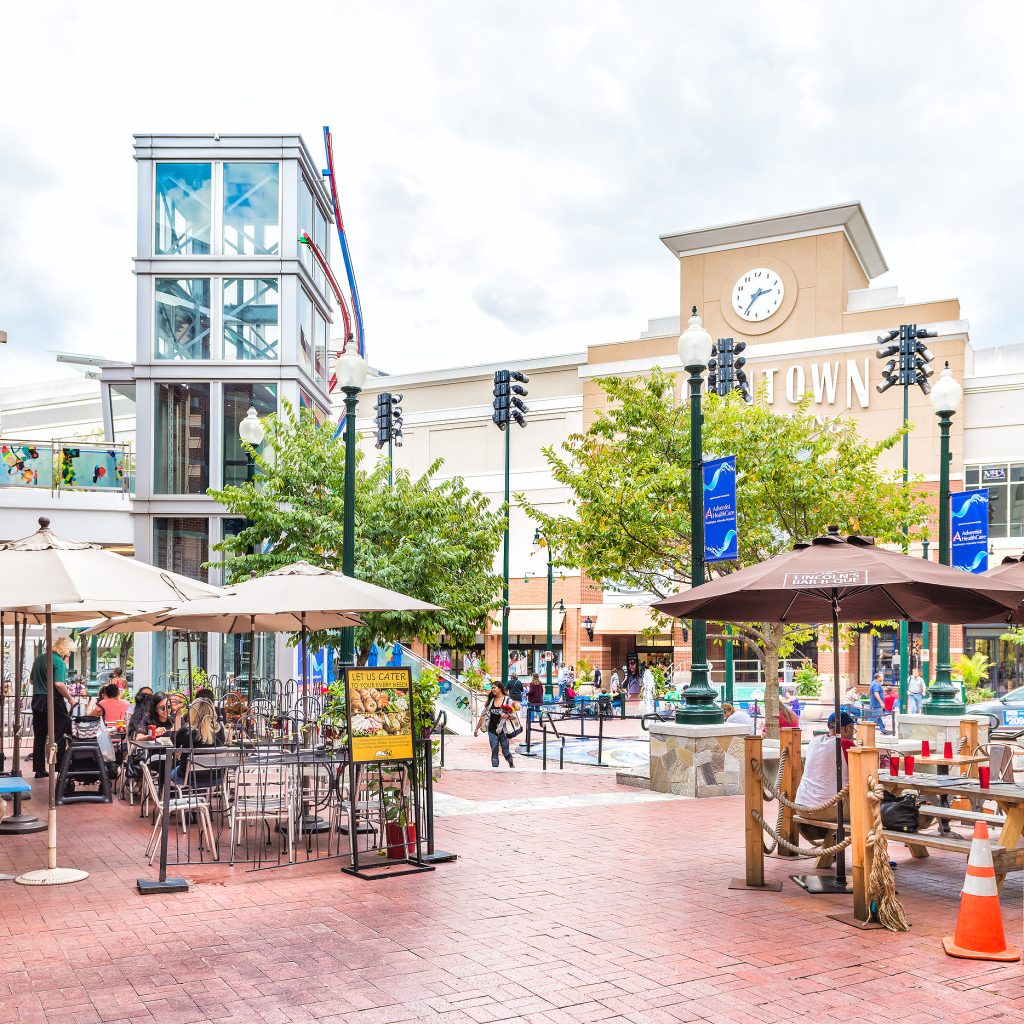 Outdoor dining and shopping scene in Downtown Silver Spring, Maryland, featuring patio seating, local restaurants, retail storefronts, and a vibrant, walkable urban atmosphere—highlighting Montgomery County living, community gathering spaces, and one of the D.C. metro area’s most popular destinations for dining, entertainment, and everyday lifestyle.