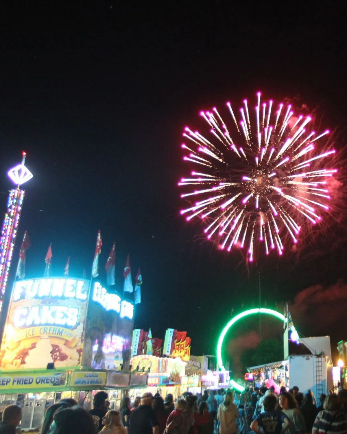 Grounds of the annual Bay-Rama Fishfly Festival with fireworks overhead held in New Baltimore, MI