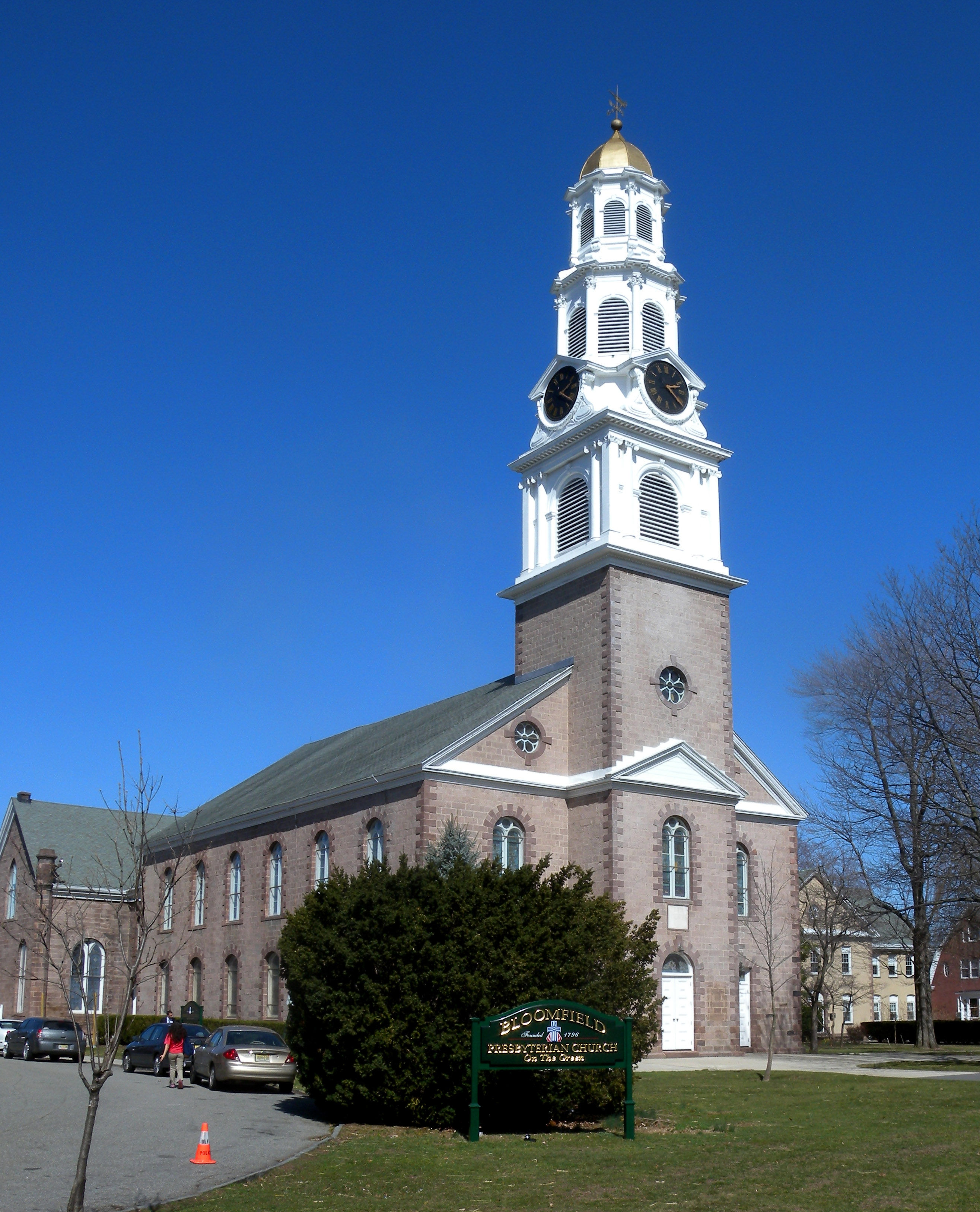 Bloomfield Presbyterian Church stands prominently in Bloomfield, New Jersey, showcasing its historic stone exterior and iconic clock tower.