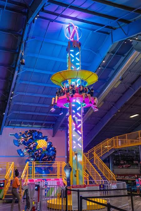 Colorful indoor Drop & Twist amusement ride at The Funplex, a family entertainment center in East Hanover featuring indoor rides, go-karts, laser tag, arcade games, and other attractions.